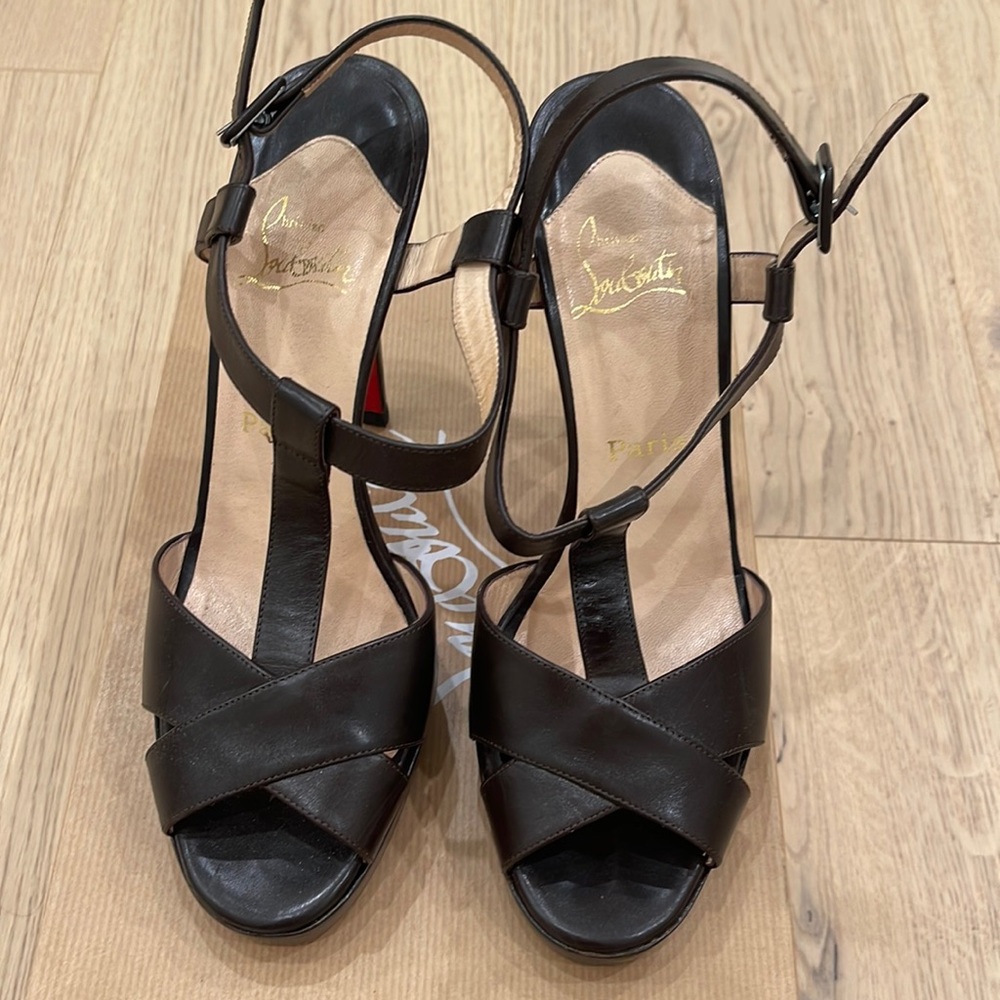 Work a handful of times. Christian Louboutin brown heels!